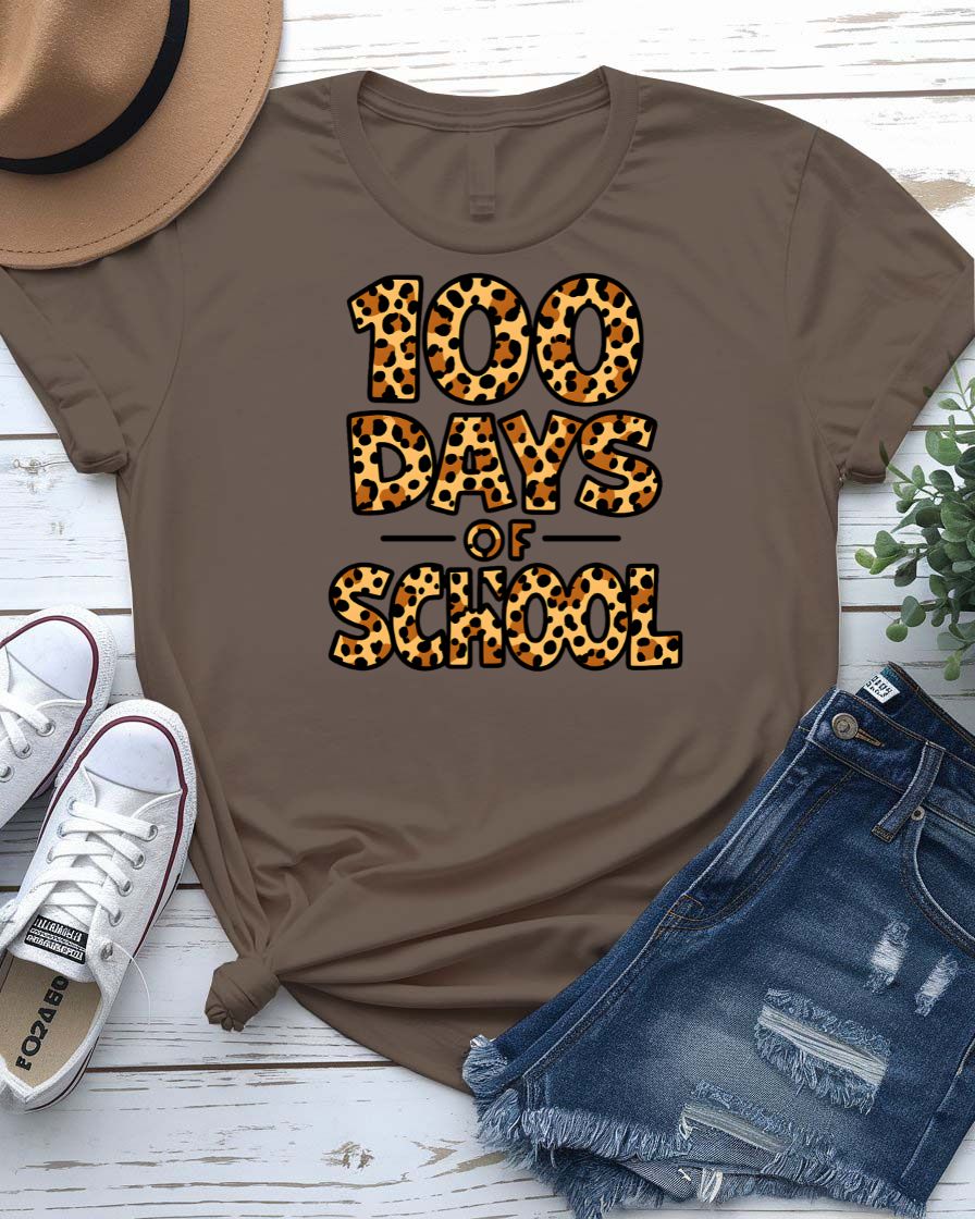 Kids 100 Days of School t-shirt in green camo with bright orange text