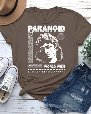 Paranoid Streetwear Tee with all-seeing eye behind chain link fence on model