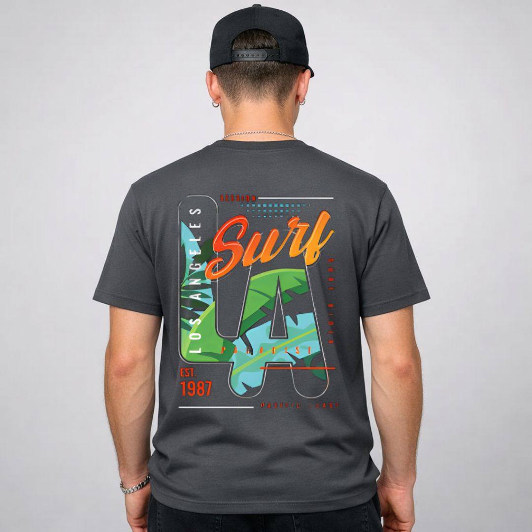 LA Surf Streetwear Tee with surfboard at sunset on model