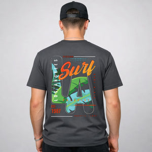LA Surf Streetwear Tee with surfboard at sunset on model