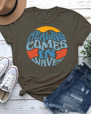 Healing Comes in Waves Tee with gentle ocean waves on model