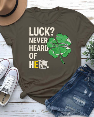 Luck Never Heard of Her St. Patrick's Tee with confident woman walking past clovers on model