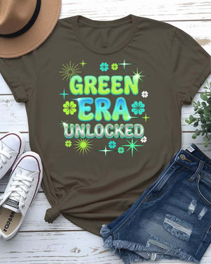 Green Era Unlocked St. Patrick's Day Tee with shamrock progress bar on model