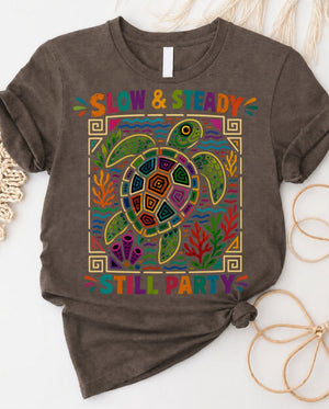 Slow and steady t-shirt with determined turtle crossing finish line design