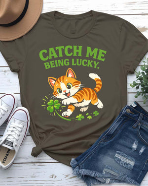 Catch Me Being Lucky St. Patrick's Day Tee with leprechaun hiding behind clover on model