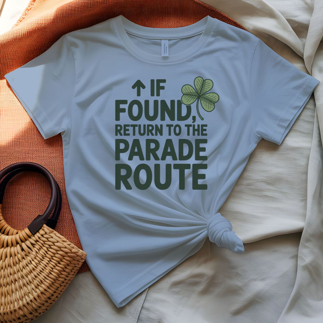 If Found Return to Parade St. Patrick's Day Tee with vintage luggage tag on model