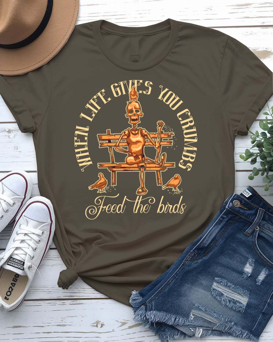 Feed The Bird T-Shirt with hand offering seeds to sparrow on model