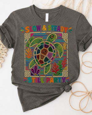 Slow and steady t-shirt with determined turtle crossing finish line design