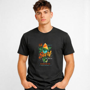 LA Surf Streetwear Tee with surfboard at sunset on model