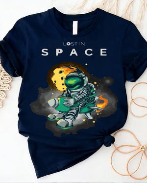 Space graphic t-shirt with astronaut floating through galaxy design front view
