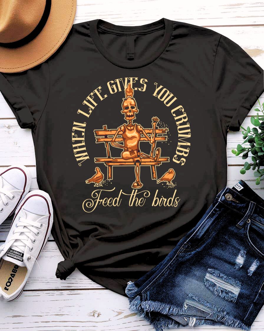 Feed The Bird T-Shirt with hand offering seeds to sparrow on model