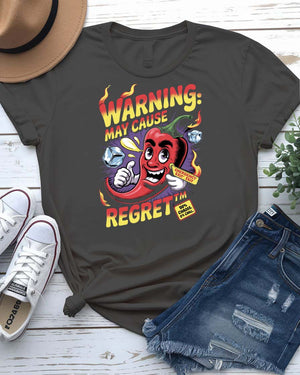 Funny t-shirt with “Warning May Cause Regret” meme quote printed in bold lettering, styled for food lovers and humor fans.