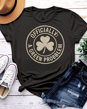 Officially A Green Problem St. Patrick's Tee with warning label design on model