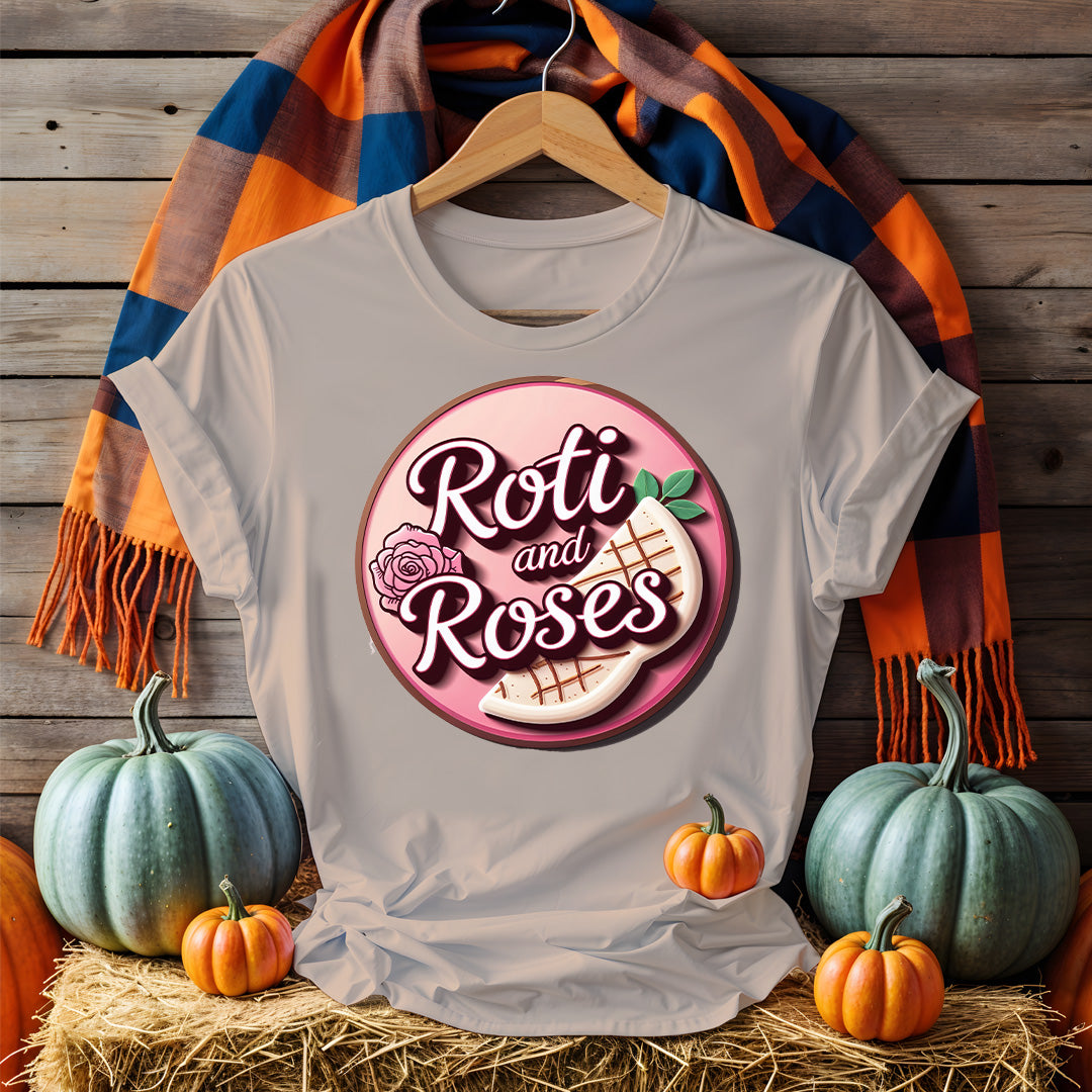 Roti and Roses Tee with chai cup and rose petals on rustic wood table