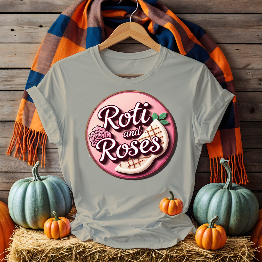 Roti and Roses Tee with chai cup and rose petals on rustic wood table