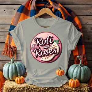 Roti and Roses Tee with chai cup and rose petals on rustic wood table